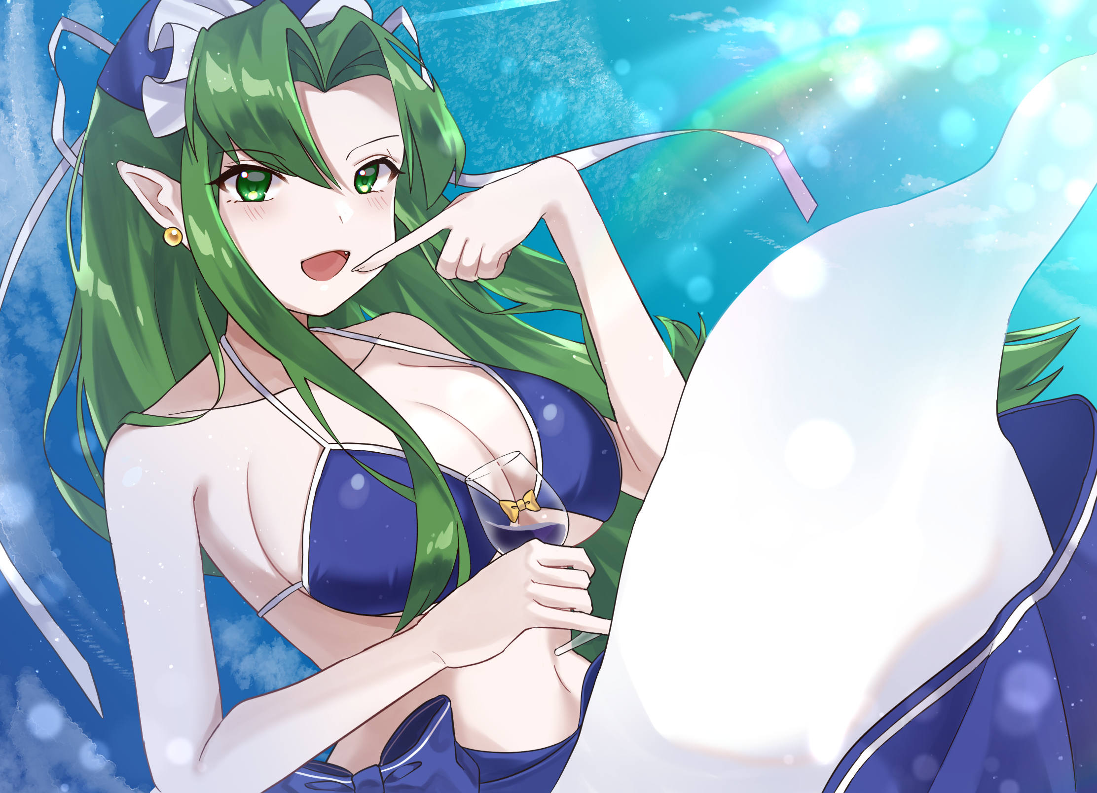 Smiling Mima in a bikini with a glass of wine, showing off her tail